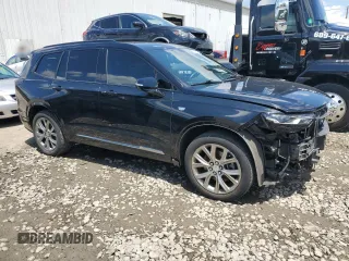 2020 Cadillac XT6 AWD Sport with VIN 1GYKPGRS2LZ121673, listed as a Copart auction lot 60315414 with 34,430 mi miles and Salvage title. Bid and sale history available at DreamBid. Image 4.