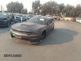 2019 Dodge Charger Scat Pack with VIN 2C3CDXGJ2KH564051, listed as a IAAI auction lot 41255283 with 64,687 mi miles and . Bid and sale history available at DreamBid. Image 2.