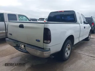 2002 Ford F-150 XL with VIN 1FTRX17202NA10047, listed as a IAAI auction lot 42122396 with 1 mi miles. Bid and sale history available at carsss.com. Image 4.