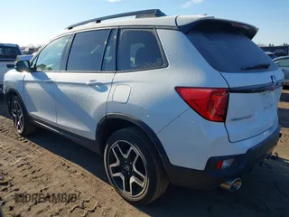 2023 Honda Passport Elite with VIN 5FNYF8H05PB005081, listed as a IAAI auction lot 41698186 with 31,853 mi miles and . Bid and sale history available at DreamBid. Image 3.