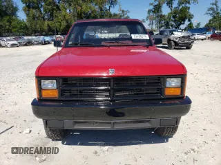 1989 Dodge Dakota z VIN 1B7GG69X9KS181359, wystawiony jako Copart lot #75638874 z przebiegiem 104 095 mil mil oraz Szkoda całkowita • Salvage title. Historia ofert i sprzedaży dostępna na DreamBid. Obrazek 5.
