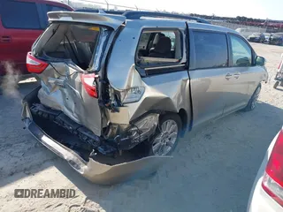 2015 Toyota Sienna XLE with VIN 5TDYK3DC0FS632909, listed as a IAAI auction lot 42012143 with 97,084 mi miles and . Bid and sale history available at DreamBid. Image 4.