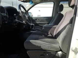 2006 GMC Envoy SLE z VIN 1GKDT13S462156541, wystawiony jako Copart lot #52500615 z przebiegiem 140 558 mil mil oraz Szkody całkowita. Historia ofert i sprzedaży dostępna na DreamBid. Obrazek 7.