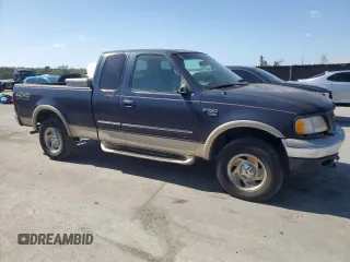 2000 Ford F-150 XL with VIN 1FTRX18L0YNB65908, listed as a Copart auction lot 54797585 with 298,924 mi miles and Clean title. Bid and sale history available at DreamBid. Image 4.