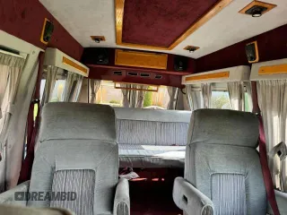 1990 GMC Vandura z VIN 1GDEG25K5L7522525, wystawiony jako Copart lot #75007594 z przebiegiem 91 857 mil mil oraz Szkody całkowita. Historia ofert i sprzedaży dostępna na DreamBid. Obrazek 9.