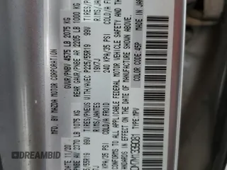 2021 Mazda CX-5 Grand Touring z VIN JM3KFADM7M1339081, wystawiony jako Copart lot #58913585 z przebiegiem Nie podano mil oraz Szkoda całkowita • Salvage title. Historia ofert i sprzedaży dostępna na DreamBid. Obrazek 13.