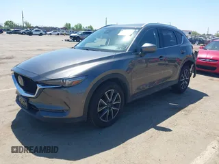 2017 Mazda CX-5 Grand Touring with VIN JM3KFADL6H0217850, listed as a IAAI auction lot 42033404 with 74,198 mi miles and . Bid and sale history available at carsss.com. Image 18.
