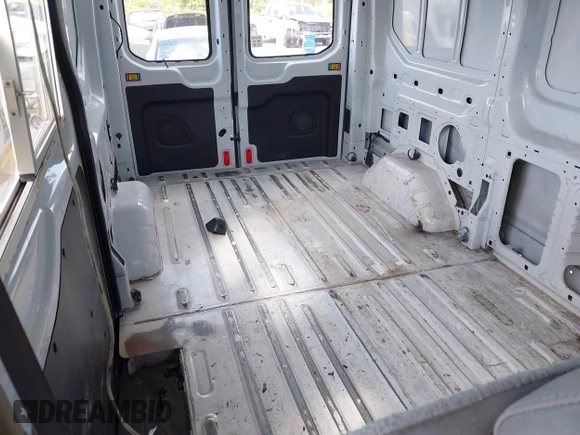 2017 Ford Transit Cargo with VIN 1FTYE1CM4HKA22561, listed as a IAAI auction lot 42118744 with 181,113 mi miles and . Bid and sale history available at DreamBid. Image 8.