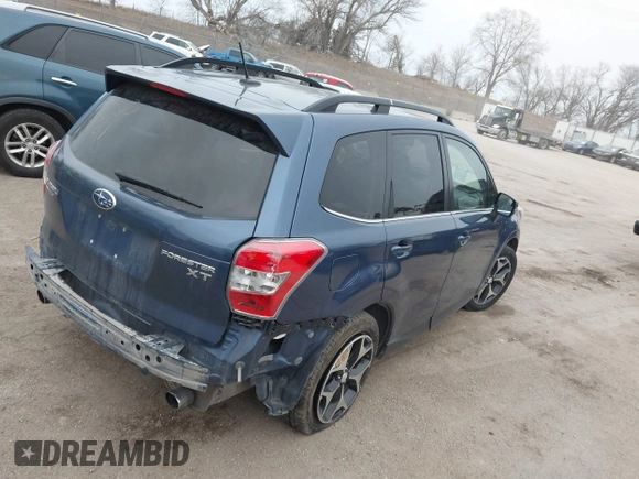 2014 Subaru Forester XT Touring with VIN JF2SJGMC9EH428341, listed as a IAAI auction lot 41185804 with 111,000 mi miles and . Bid and sale history available at DreamBid. Image 4.