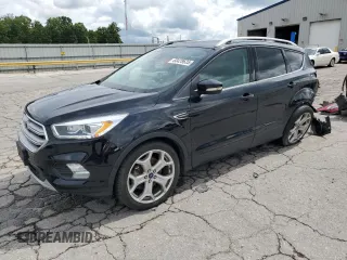 2018 Ford Escape Titanium with VIN 1FMCU0J92JUC84901, listed as a Copart auction lot 60428635 with 69,210 mi miles and Salvage title. Bid and sale history available at DreamBid. Image 1.