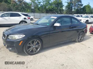 2015 BMW 2 Series M235i with VIN WBA1J7C5XFV253790, listed as a Copart auction lot 57155255 with 136,967 mi miles and Salvage title. Bid and sale history available at DreamBid. Image 1.
