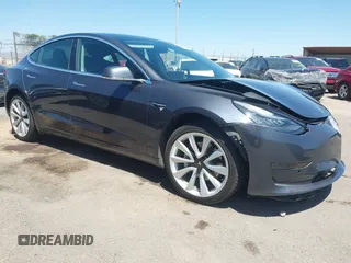 2019 Tesla Model 3 Mid Range z VIN 5YJ3E1EA0KF475996, wystawiony jako IAAI lot #42184584 z przebiegiem Nie podano mil oraz . Historia ofert i sprzedaży dostępna na DreamBid. Obrazek 1.