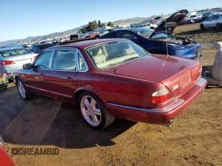 1999 Jaguar XJ with VIN SAJPX1849XC857869, listed as a Copart auction lot 83773914 with 172,496 mi miles and Clean title. Bid and sale history available at DreamBid. Image 2.