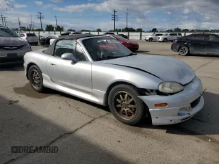 2003 Mazda MX-5 Miata Cloth z VIN JM1NB353X30311086, wystawiony jako Copart lot #57685445 z przebiegiem 141 634 mil mil oraz Szkoda całkowita • Salvage title. Historia ofert i sprzedaży dostępna na DreamBid. Obrazek 4.