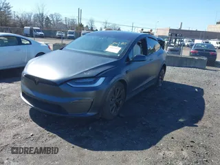 2022 Tesla Model X with VIN 7SAXCDE52NF345835, listed as a IAAI auction lot 41823522 with 24,401 mi miles and . Bid and sale history available at DreamBid. Image 2.