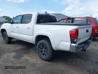 2021 Toyota Tacoma SR z VIN 5TFCZ5AN5MX265181, wystawiony jako IAAI lot #42077902 z przebiegiem 102 192 mil mil oraz . Historia ofert i sprzedaży dostępna na DreamBid. Obrazek 3.