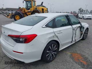 2024 Honda Civic EX z VIN 2HGFE1F77RH337748, wystawiony jako IAAI lot #42047010 z przebiegiem 5 598 mil mil oraz . Historia ofert i sprzedaży dostępna na DreamBid. Obrazek 4.