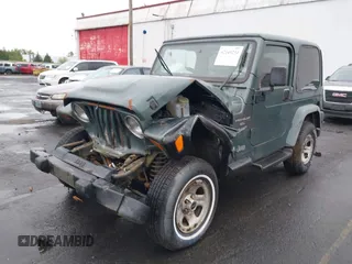 1999 Jeep Wrangler Sport with VIN 1J4FY19S6XP428003, listed as a IAAI auction lot 42149234 with 1 mi miles. Bid and sale history available at carsss.com. Image 2.