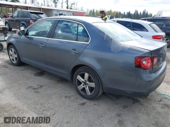 2009 Volkswagen Jetta Sedan SE with VIN 3VWRM71K59M069259, listed as a IAAI auction lot 41818850 with 164,157 mi miles. Bid and sale history available at carsss.com. Image 3.