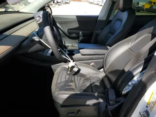 2021 Tesla Model Y Long Range z VIN 5YJYGDEE5MF275302, wystawiony jako Copart lot #54353875 z przebiegiem 63 196 mil mil oraz Szkoda całkowita • Salvage title. Historia ofert i sprzedaży dostępna na DreamBid. Obrazek 7.