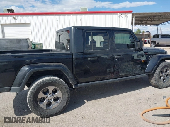 2021 Jeep Gladiator Willys with VIN 1C6HJTAG7ML523718, listed as a IAAI auction lot 42206058 with 48,071 mi miles and . Bid and sale history available at DreamBid. Image 13.