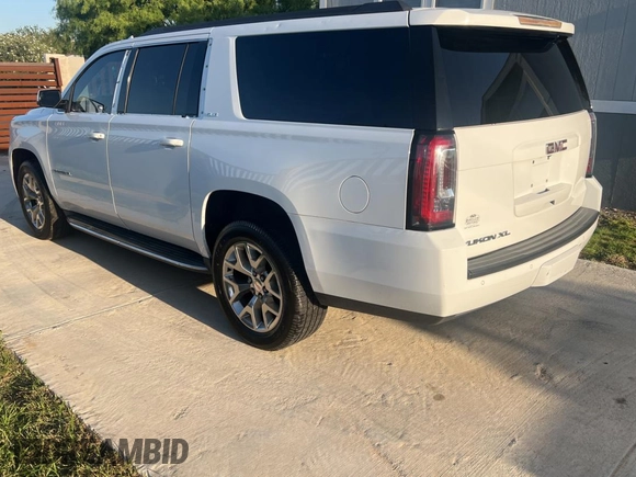 2016 GMC Yukon XL SLE with VIN 1GKS1FKC4GR126775, listed as a Copart auction lot 52828325 with 110,002 mi miles and Clean Title. Bid and sale history available at carsss.com. Image 3.