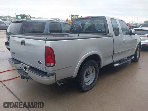 2003 Ford F-150 XL with VIN 2FTRX17223CA73626, listed as a IAAI auction lot 42027926 with 127,614 mi miles. Bid and sale history available at carsss.com. Image 4.