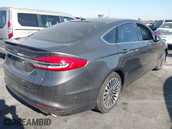 2017 Ford Fusion Titanium z VIN 3FA6P0SU5HR105477, wystawiony jako IAAI lot #41072696 z przebiegiem 92 926 mil mil oraz . Historia ofert i sprzedaży dostępna na DreamBid. Obrazek 4.