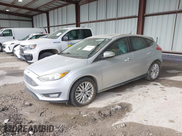 2015 Ford Focus Titanium z VIN 1FADP3N2XFL348149, wystawiony jako IAAI lot #41983021 z przebiegiem 208 765 mil mil oraz . Historia ofert i sprzedaży dostępna na DreamBid. Obrazek 2.