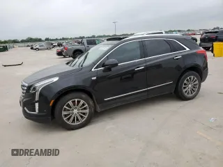 2018 Cadillac XT5 Luxury FWD with VIN 1GYKNCRSXJZ141391, listed as a Copart auction lot 55261845 with 76,959 mi miles and Salvage title. Bid and sale history available at DreamBid. Image 1.