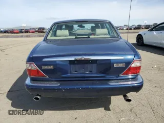 2000 Jaguar XJ with VIN SAJDA14C7YLF18873, listed as a Copart auction lot 50032495 with Not Provided miles and Salvage Title. Bid and sale history available at DreamBid. Image 6.