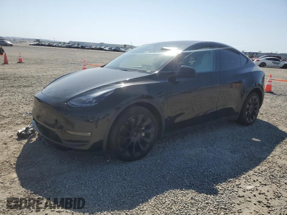 2023 Tesla Model Y Long Range with VIN 7SAYGAEE0PF642810, listed as a Copart auction lot 52181655 with 74,922 mi miles and Salvage Title. Bid and sale history available at DreamBid. Image 1.