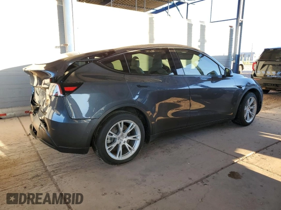 2021 Tesla Model Y Long Range with VIN 5YJYGDEEXMF151557, listed as a Copart auction lot 54936885 with 106,411 mi miles and Salvage Title. Bid and sale history available at DreamBid. Image 3.