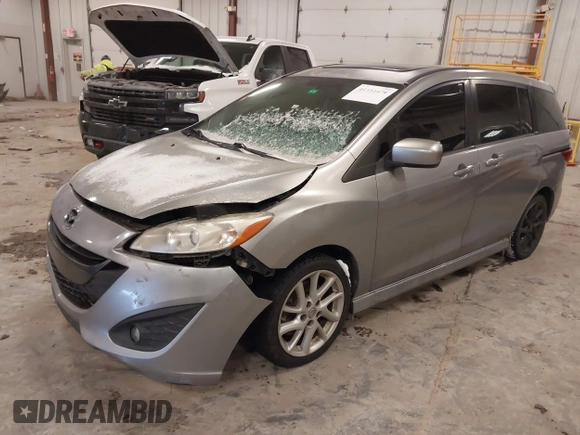 2012 Mazda 5 Touring z VIN JM1CW2CL1C0107706, wystawiony jako IAAI lot #41551479 z przebiegiem 123 418 mil mil oraz . Historia ofert i sprzedaży dostępna na DreamBid. Obrazek 2.