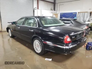 2005 Jaguar XJ Vanden Plas z VIN SAJWA82C65SG44373, wystawiony jako Copart lot #84091444 z przebiegiem 141 993 mil mil oraz Szkoda całkowita • Salvage title. Historia ofert i sprzedaży dostępna na DreamBid. Obrazek 2.