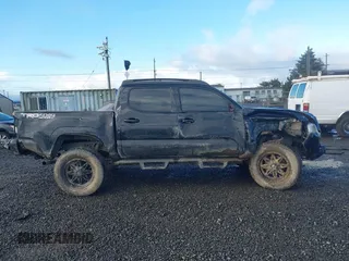 2020 Toyota Tacoma SR5 z VIN 5TFCZ5AN9LX216032, wystawiony jako IAAI lot #41448197 z przebiegiem 128 581 mil mil oraz . Historia ofert i sprzedaży dostępna na DreamBid. Obrazek 14.