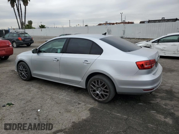 2015 Volkswagen Jetta SE with VIN 3VWD17AJ5FM260475, listed as a Copart auction lot 84764864 with 119,189 mi miles and Salvage title. Bid and sale history available at DreamBid. Image 2.