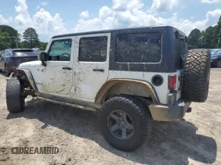 2015 Jeep Wrangler Unlimited Rubicon with VIN 1C4BJWFG6FL710993, listed as a Copart auction lot 62308195 with 103,938 mi miles and Salvage title. Bid and sale history available at DreamBid. Image 2.