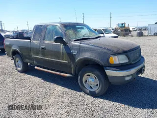 2000 Ford F-150 XL with VIN 1FTRX18L6YKB06492, listed as a IAAI auction lot 42058110 with 169,217 mi miles. Bid and sale history available at carsss.com. Image 1.
