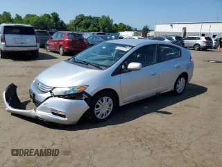 2010 Honda Insight LX with VIN JHMZE2H58AS038830, listed as a Copart auction lot 61157475 with 157,931 mi miles and Salvage title. Bid and sale history available at DreamBid. Image 1.