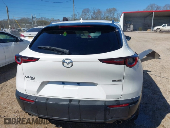 2022 Mazda CX-30 S Premium with VIN 3MVDMBDL1NM413540, listed as a IAAI auction lot 41681191 with 57,764 mi miles and . Bid and sale history available at carsss.com. Image 17.