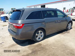 2012 Honda Odyssey Touring with VIN 5FNRL5H93CB109394, listed as a IAAI auction lot 42280018 with 190,412 mi miles and . Bid and sale history available at DreamBid. Image 4.