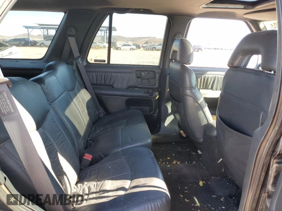 1997 GMC Jimmy SLS with VIN 1GKDT13W8V2560329, listed as a Copart auction lot 80992204 with 231,051 mi miles and Salvage Title. Bid and sale history available at carsss.com. Image 10.
