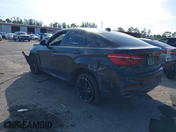 2018 BMW X6 sDrive35i with VIN 5UXKU0C5XJ0G80724, listed as a IAAI auction lot 41274338 with 122,696 mi miles. Bid and sale history available at carsss.com. Image 3.