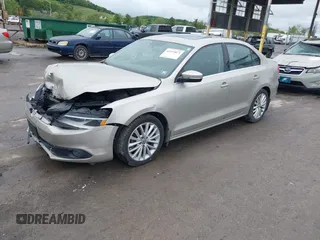 2014 Volkswagen Jetta TDI w/Premium/Nav with VIN 3VWLL7AJ9EM226026, listed as a IAAI auction lot 42219871 with 100,386 mi miles and . Bid and sale history available at DreamBid. Image 2.