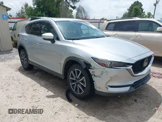 2018 Mazda CX-5 Grand Touring z VIN JM3KFADM6J0339185, wystawiony jako IAAI lot #42160763 z przebiegiem 86 312 mil mil oraz . Historia ofert i sprzedaży dostępna na DreamBid. Obrazek 1.