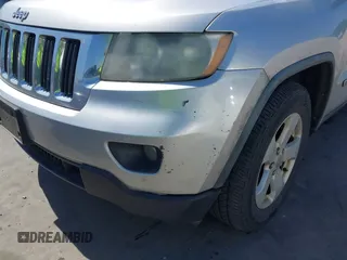 2012 Jeep Grand Cherokee Laredo with VIN 1C4RJEAG5CC112230, listed as a IAAI auction lot 41997483 with 302,923 mi miles. Bid and sale history available at carsss.com. Image 6.