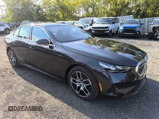 2024 BMW i5 eDrive40 with VIN WBY33FK05RCR58520, listed as a Copart auction lot 77179704 with 16 mi miles and Salvage Title. Bid and sale history available at carsss.com. Image 3.