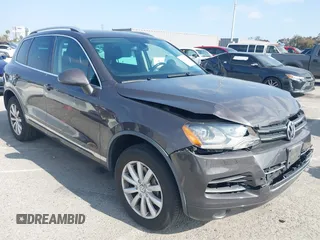 2011 Volkswagen Touareg Sport with VIN WVGFF9BP3BD002517, listed as a IAAI auction lot 42174143 with 156,337 mi miles and . Bid and sale history available at DreamBid. Image 1.