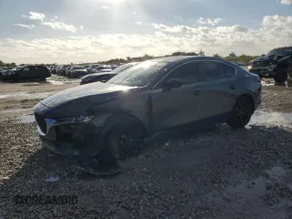 2024 Mazda 3 S Carbon Edition z VIN 3MZBPBCM8RM408266, wystawiony jako Copart lot #45877275 z przebiegiem 10 159 mil mil oraz Szkoda całkowita • Salvage title. Historia ofert i sprzedaży dostępna na DreamBid. Obrazek 1.